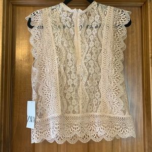 Like pink lace Zara shirt.  NWT